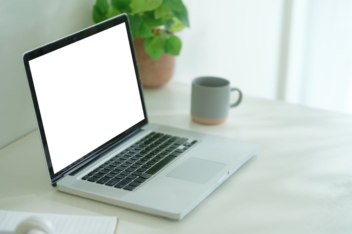 Modern workspace with laptop showing website design