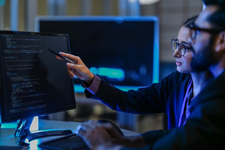 Diverse AI developers collaborating in a late-night coding session